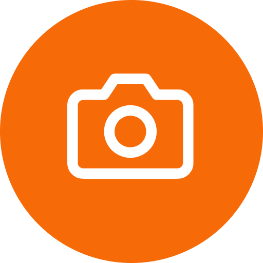 The Waystation logo – a stylized icon of a camera drawn in white outline inside an orange-colored circle.